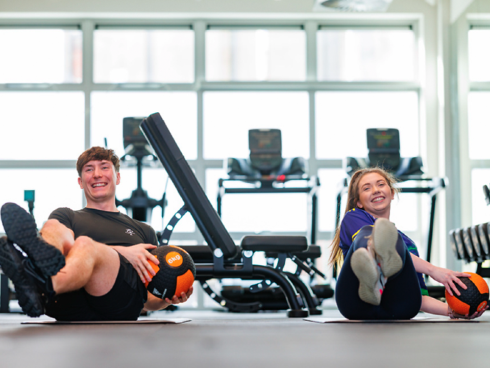 two people working out in a gym